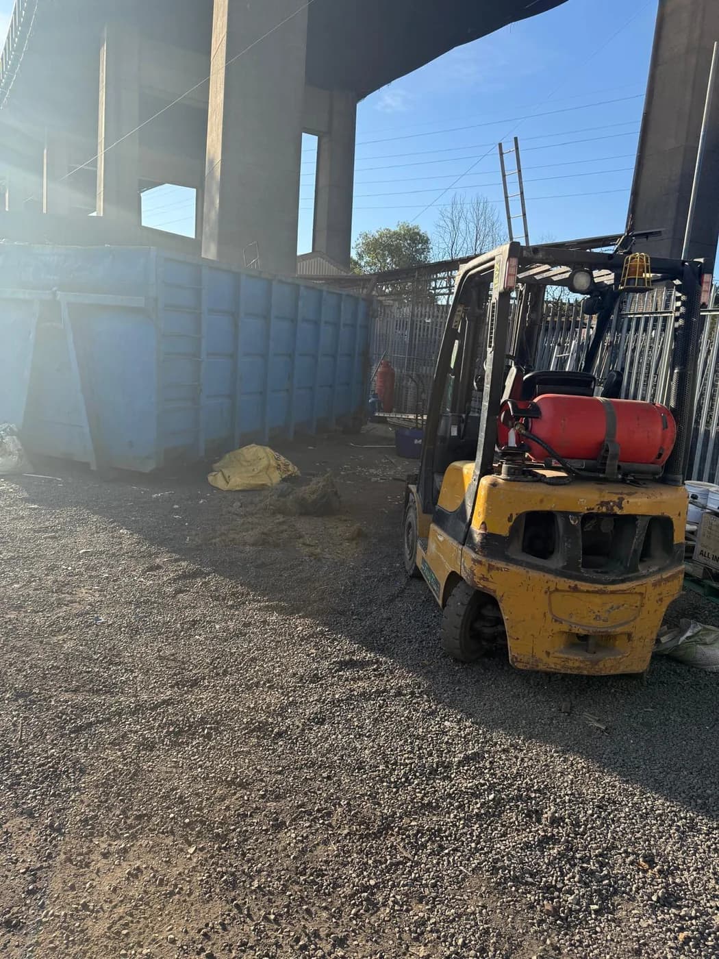 A forklift working the recycling yard at Jersey Marine
