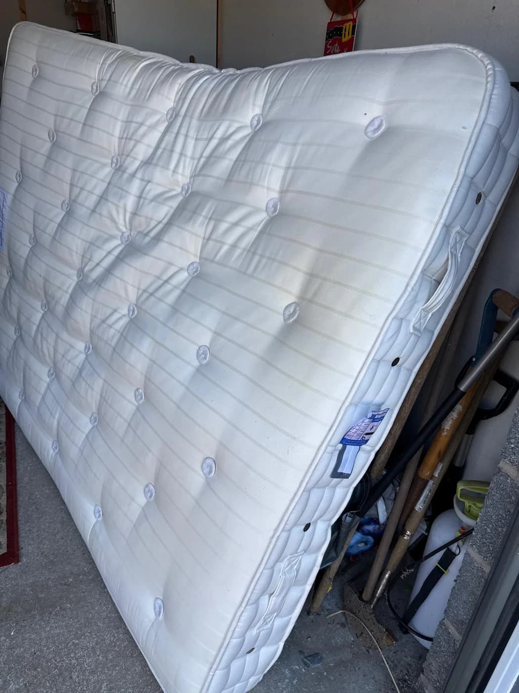 A garage clearance load of stored items and mattresses in Neath